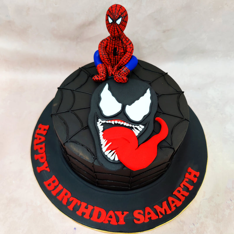This spectacular Spiderman Venom Cake swings into action with its dramatic design and clever comic book details. 
