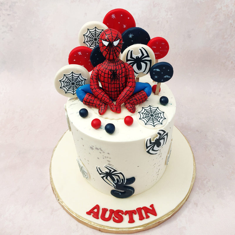 With its white base, this Marvel superhero cake captures the essence of Spiderman's iconic costume, while the intricate details bring the Marvel universe to life.