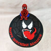 This Spiderman and Venom Birthday Cake features a sleek black fondant exterior meticulously embossed with an intricate spiderweb pattern that radiates outward, capturing the iconic imagery associated with the beloved superhero. 
