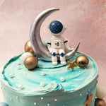 But it's the silver crescent moon atop this blue Moon Astronaut Cake that steals the show, serving as the perfect perch for our intrepid astronaut. 