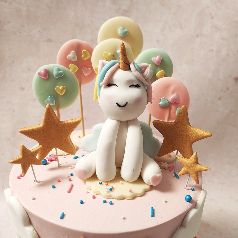 Upon the tender base of this rainbow unicorn cake, a majestic unicorn, with a mane as colourful as a rainbow and a horn glistening with the promise of adventure, stood proudly as the guardian of childhood wonder.