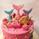 Buttercream peaks rise like gentle waves, while a sandy bottom adds a touch of beachside charm to this Starfish Cake. 