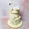 Adorned with a majestic swan wearing a delicate crown, this Swan Cake design captures the essence of beauty and purity. 