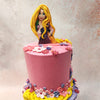 On top of this captivating base sits the second tier of this Rapunzel theme cake, adorned in a shade of pink. 