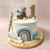 This teddy bear birthday cake for kids is set atop the sky, with the white base representing the clouds. 
