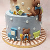 Adorable teddy bears, toy trains, toy planes, toy cars, hot air balloons, and letter blocks scatter across each tier of this nursery cake. 