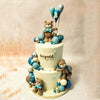 As you gaze upon the smooth white tiers of this Teddy Balloon Cake, adorned with the sweetest brown teddy bears sporting dashing blue bow ties, you'll feel the joy of childhood come to life.