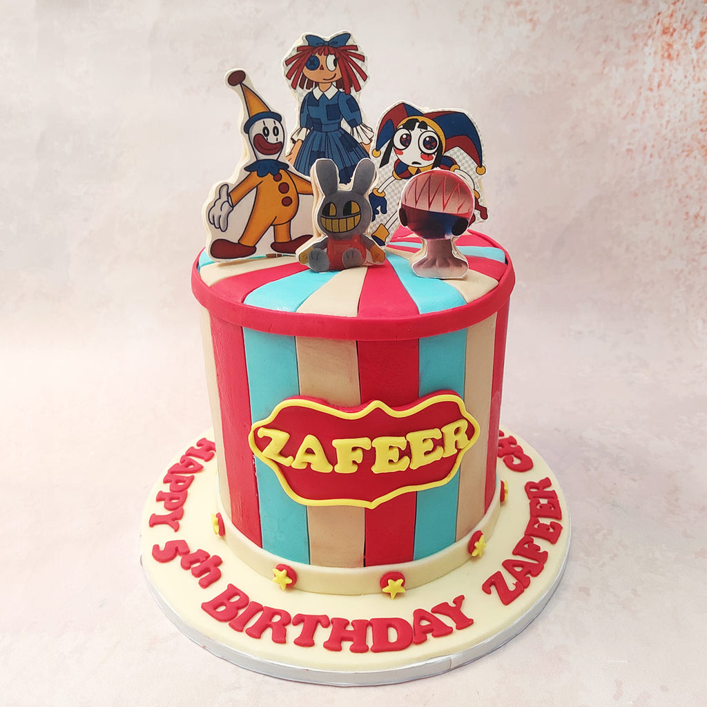 Picture this: The Amazing Digital Circus Cake made out of the grand Big Top Circus Tent recreated in edible form, serving as the magnificent base of our masterpiece  