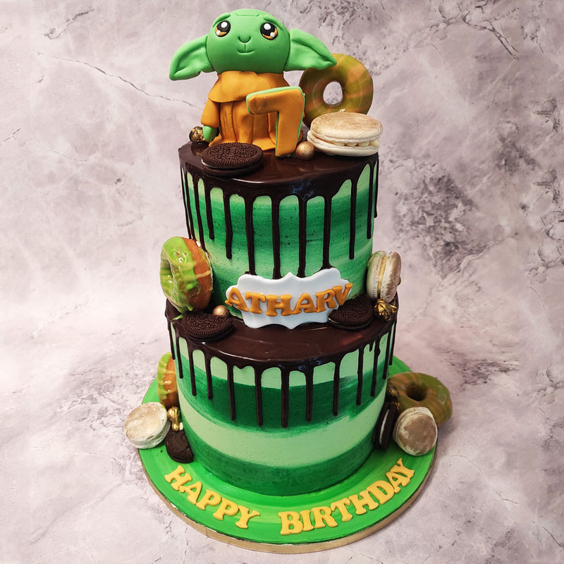 The layers of this Yoda cake with donuts design blend seamlessly from a deep forest green to a vibrant light green, creating a stunning visual effect that will leave everyone in awe.