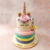 Atop the second tier of this Unicorn Rose Cake, a pristine white canvas adorned with a dainty pink ribbon sets the stage for the mystical protagonist – a unicorn with closed eyes and a blushing countenance. 