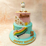 Set upon a pastel pink and blue base,, this two-tiered Little Unicorn Cake captures the essence of fantasy. 