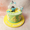 The top of this Washing Machine Cake features a detailed fondant washing machine, complete with buttons, dials, and a front-loading door, cleverly left open to reveal a figure playfully popping out, evoking a sense of mischief and fun. 