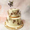 Crafted with meticulous care, this Gold Butterfly Cake boasts two tiers of creamy white, adorned with regal gold butterflies encircling like a dream. 