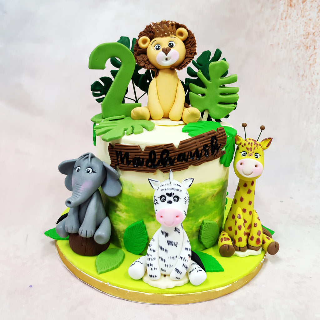 This Wild Animals Cake is a jungle jamboree in fondant, bursting with personality and charm for your little adventurer’s big day. 
