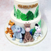 This handcrafted Wildlife Cake also showcases a menagerie of adorable jungle companions elegantly arranged against pristine ivory buttercream.