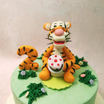 As you gaze upon this Winnie The Pooh theme cake, you'll notice charming buttercream bushes bursting with vibrant flowers, adding a touch of enchantment to the scene.