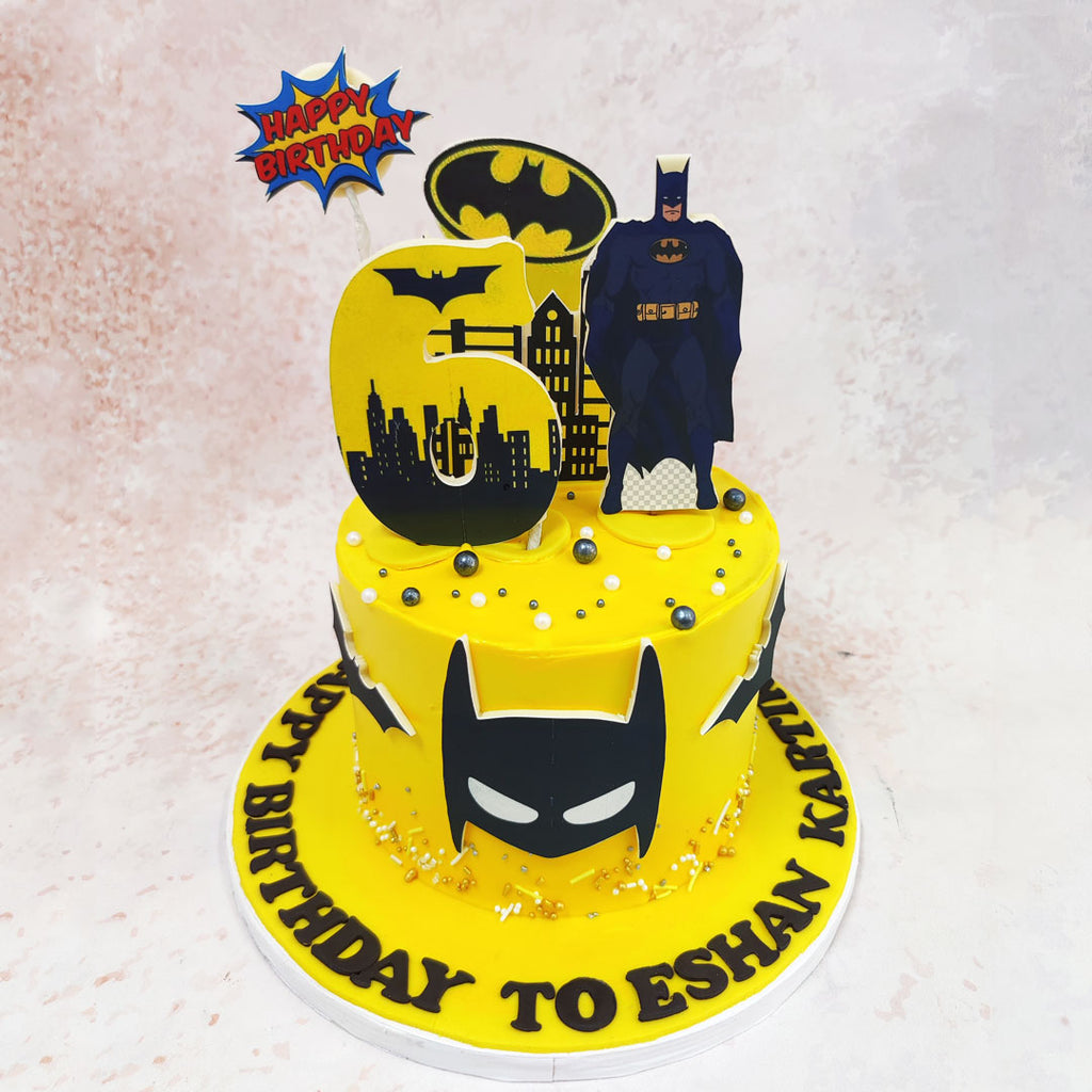 This electrifying Yellow Batman Cake is a celebration of all things Caped Crusader, featuring a dynamic array of Gotham City-inspired elements that are sure to delight any young superhero fan. 