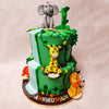 This Elephant and Giraffe Cake has a green base, adorned with intricately crafted green vines, instantly captures the essence of a dense jungle.