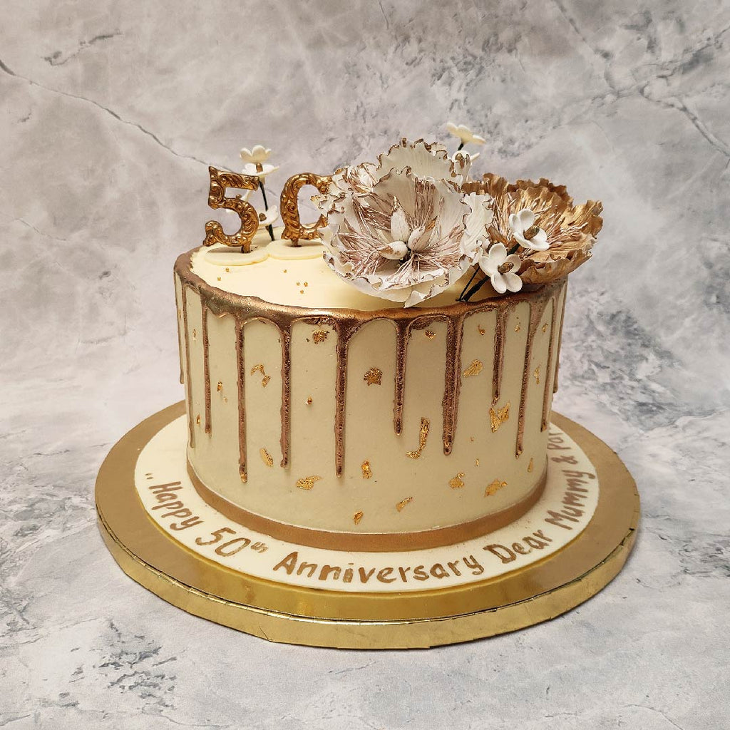 This 50th anniversary cake is special to celebrate the 50 years of togetherness. This golden drip floral anniversary cake has all the elements that can make a 50th anniversary special