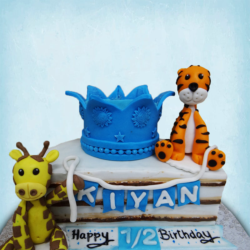 This adorable animal themed half birthday cake was created to be toddler friendly and looks more like something you would get at a toy shop than a cake shop