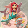 Made famous from the Disney 28th animated film and an all-time classic: The Little Mermaid, Ariel is the protagonist known for her gorgeous teal tail, peppy personality and striking Auburn hair, as can be seen in the figurine of her sitting on top of this Ariel cake.