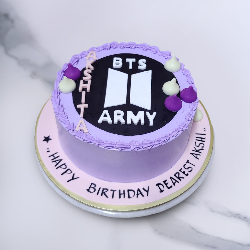 BTS theme cake for a BTS fan with BTS army logo on top and a beautiful designing on the cake