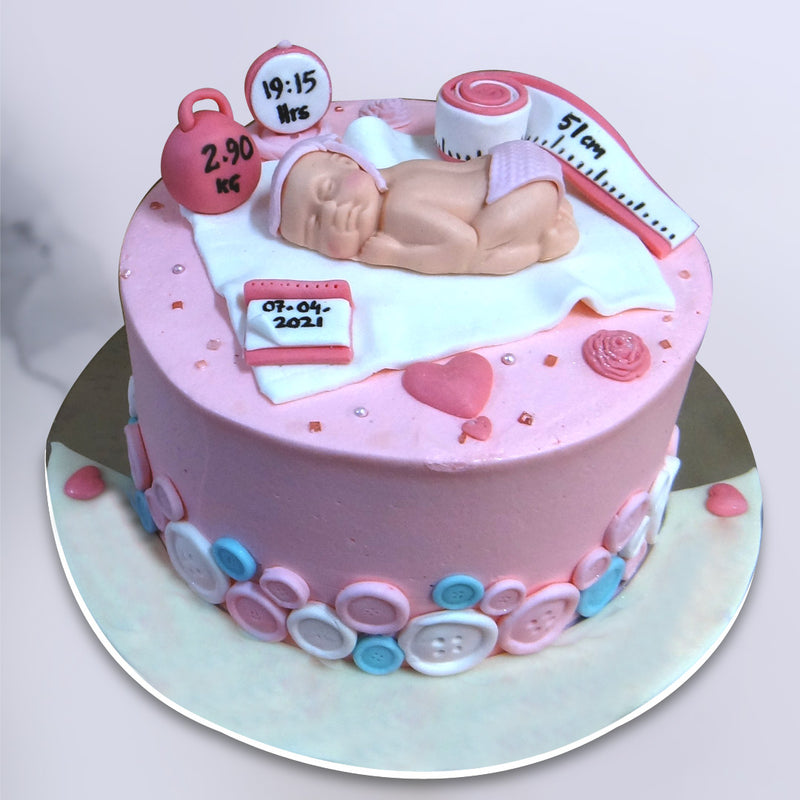 Babygirl welcome cake with cute little eatable elements on top of the cake. This is a prefect baby welcome cake especially baby girl cake 