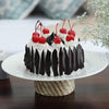 This is black forest cake decorated with cherries on top and chocolate shavings on side of the cake, this dark forest cake look elegant and taste really awesome