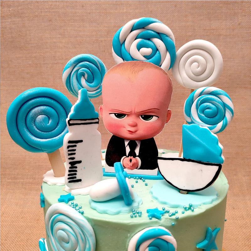 Zoomed view of boss baby theme cake with elements related to movies "Boss baby" decorated in a beautiful way