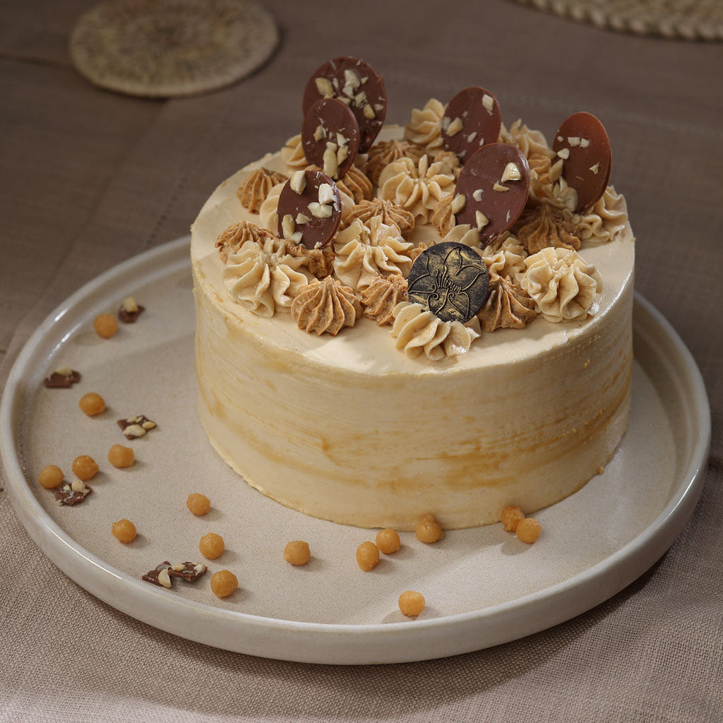 Butterscotch cake is an iconic cake at liliyum, This caramel butterscotch cake is soft, creamy and holds a delicious taste in it. Order online butterscotch cake for same day delivery across Bangalore. 