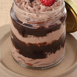 Chocolate jar cake zoomed view to showcase you the thick layers of chocolate ganache between the chocolate sponge. This chocolate cake in a jar is an absolute delight to have