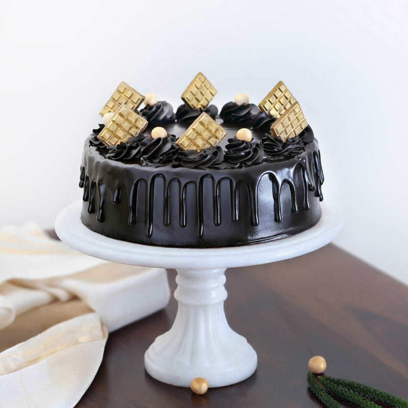 Chocolate truffle cake with chocolate drips on top of the cake looks classy and tasty. Order online chocolate ganache cake for same day delivery across bangalore 
