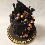 The one-sided ornamentation on this chocolate anniversary cake gives the design an asymmetrical aesthetic that adds to the visual appeal.
