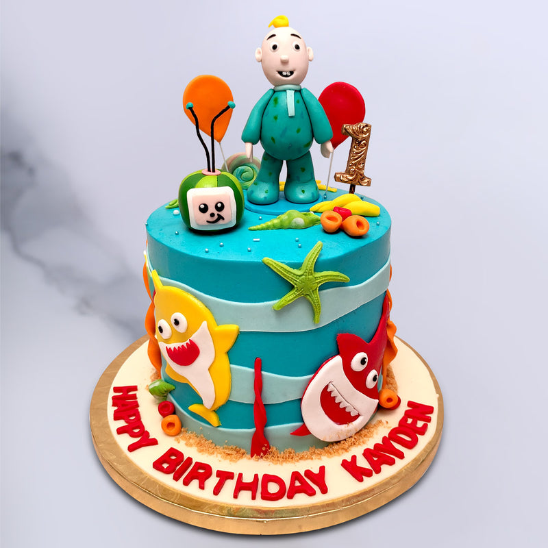 Cocomelon and baby shark theme cake is a unique combination of two of the most loved cartoons by kids. So this kids birthday cake is surely a cake your kid will enjoy cutting with a huge smile on their face exactly the same as baby jj on top of this cake