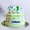 Cocomelon cake with cocomelon cartoon theme elements on top of the cake. This cocomelon cake is perfect as kids first birthday cake