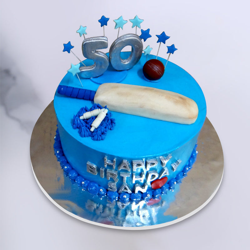 As a perfect fit for a 50th birthday cake, a cricket birthday cake  or a father’s birthday cake, the representation of the cricket cake design as a triple threat in the triple colour theme of blue, white and silver adds another dimension to the overall aesthetic look of this cricket cake, which we aim to match in flavour.