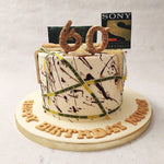 Featuring a white base, smeared with dark red splashes like blood on the walls of house-turned-crime-scene, this Sony TV cake also features the yellow police tape lines placed all over with the words "crime scene do not cross" on it. 