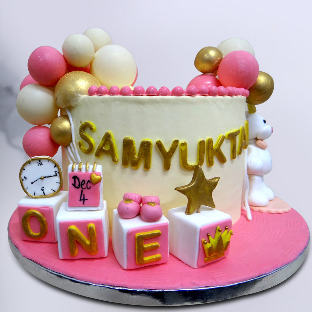 This cute teddy bear birthday cake is bundle of happiness as you can see lot of elements in this cute teddy bear cake for baby girl. This baby girl first birthday cake is surely the best cake in town