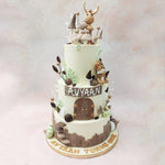 With a clean, white tone forming the base of each tier, this fairytale cake design showcases a number of elements taken straight out of a storybook, from the three-dimensional brown and green miniature pumpkins to the ascending staircase of mushrooms at the bottom to the realistic flora embedded all over to the buttercream palm leaves that can be spotted all over this birthday cake for kids 