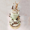   From the wood tones and textures ornamenting the bottom tier, to the wooden door and placard embellishing the middle tier, this is a woodland animal theme cake through and through.