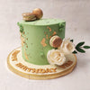 This macaron cake design features a pastel green base acting as a stand-in for grass. 