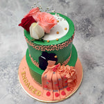 This floral engagement cake is no ordinary green cake with flowers, it is intricate artwork brought to life in the form of cake.  From the lush green colour used on the base of both tiers to the fresh pink, white and red roses alongside the baby's breath on top, every element on this green engagement cake has been carefully planned and placed