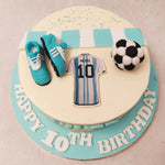 This Messi birthday cake features a simplistic, artistic and minimalistic design with most popular elements associated with this sport on top. 