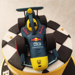 The RBR car on top of this Formula 1 themed birthday cake pays homage to this popular F1 racing team 