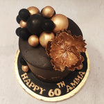  This black and gold rose cake is centred around the large, edible gold flower on top. A symbol of extravagant love and treasured affection.