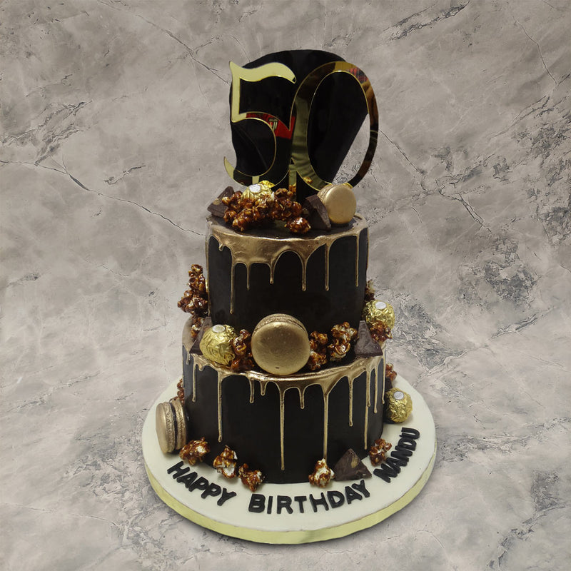 This golden drip 50th birthday cake or anniversary cake is to celebrate a huge milestone in life. 50th birthday cake are really important in everyone's life and it has to be celebrated in a grand way just like this 2 tier golden drip cake