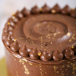 Tasty Chocolate cake zoomed image which shows the domed chocolate cream on top of the chocolate birthday cake
