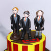 Close up image of Harry potter custom cake with harry and friends on the top of the cake as harry potter cake topper 