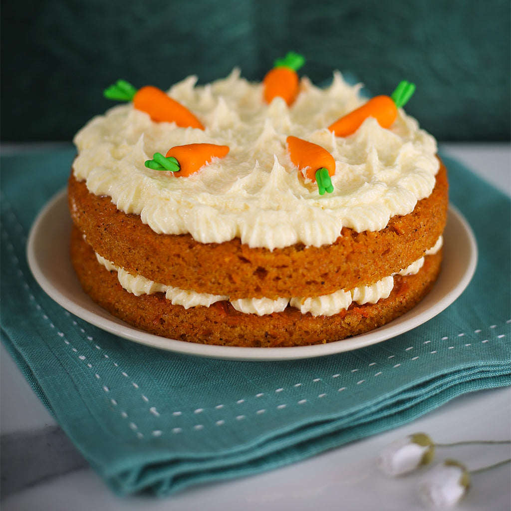 Happy mothers day cake for all mothers in bangalore. This cake has got cream cheese filling and soft sponge with 5 fondant carrots on top of the mothers day carrot cake.