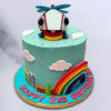This cute helicopter theme cake where a smiling helicopter is looking straight at you with glaring eyes. This cute aeroplane cake holds a beautiful rainbow also which makes this helicopter cake even more amazing and eye catchy.